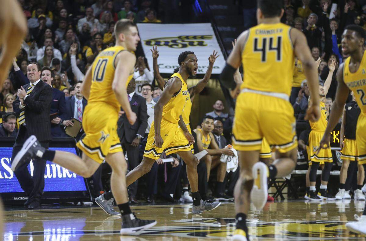 Wichita State forward Markis McDuffie celebrates a three-pointer during the first half of their game against Tulane at Koch Arena on Saturday.