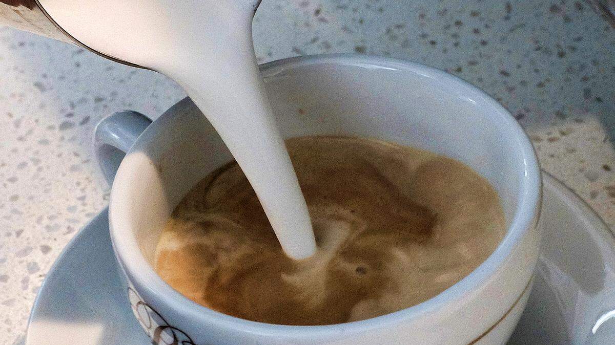 In this photo taken in 2017, a barista pours steamed milk in a coffee at a cafe in Los Angeles.