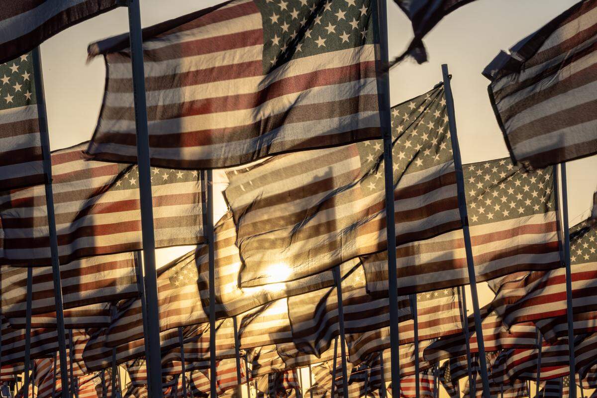 A field of American flags on display at the Machinist Union near I-235 and South Meridian blow in the wind. The display is placed every year to commemorate Memorial Day.