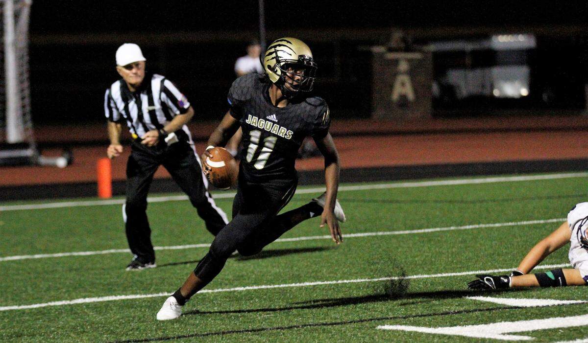Andover Central junior quarterback Shomari Parnell looks downfield during the Jaguars’ 27-17 win over Valley Center on Thursday. (Sept. 20, 2018)