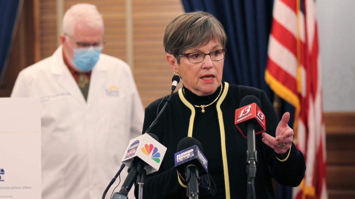 Kansas Gov. Laura Kelly answers questions from reporters during a news conference in which she announces that the state will shut down its system for processing unemployment claims to combat fraud. The 2 1/2-day shutdown will delay payments to some jobless workers while the state installs anti-fraud updates. (Jan. 27, 2021)