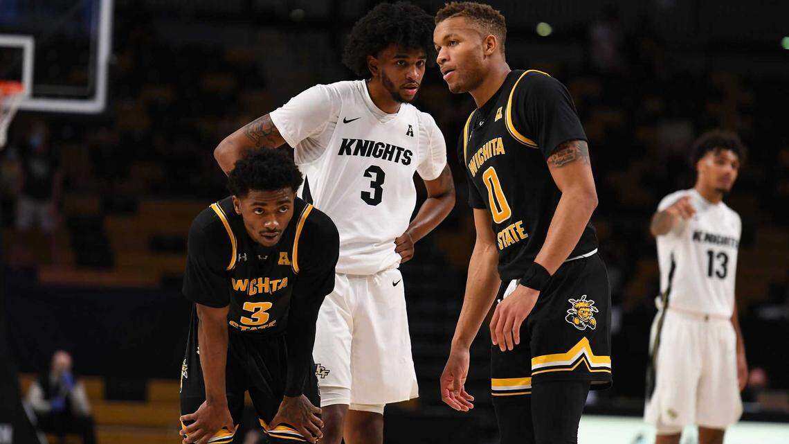 Wichita State’s Alterique Gilbert (3) and Dexter Dennis (0) pictured during the Shockers’ 61-60 win over Central Florida in Orlando this season.