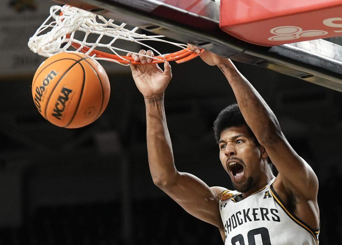 Wichita State University’s Harold Beverly with a slamdunk in the second half against Monmouth at Koch Arena. 