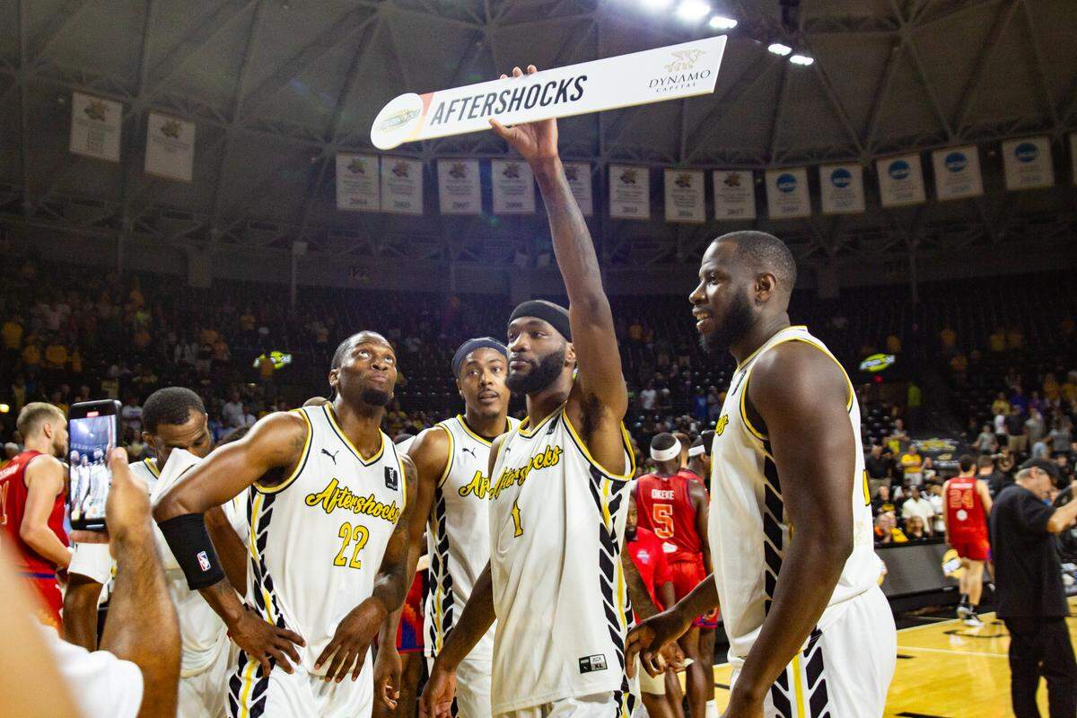 Markis McDuffie holds up the AfterShocks plate after defeating Midtown Prestige in last year’s The Basketball Tournament.