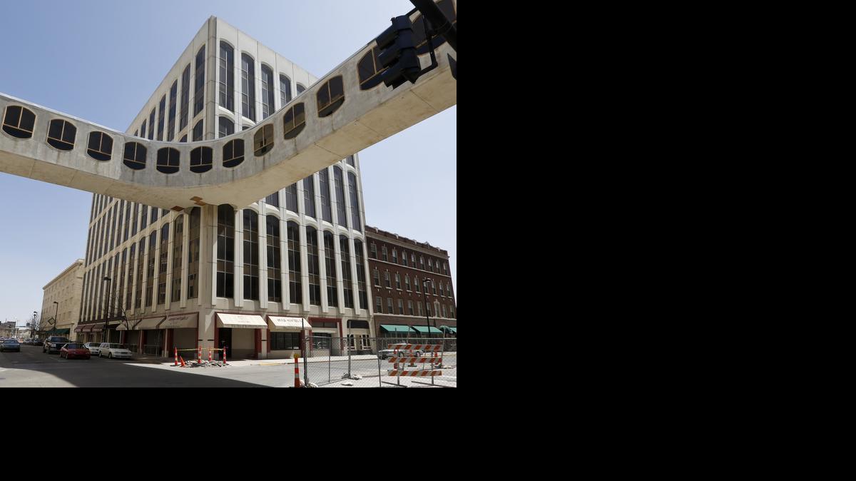 Sutton Place, a largely vacant 11-story office building at Market and William streets, had been legally divided into floors and sold separately. 


