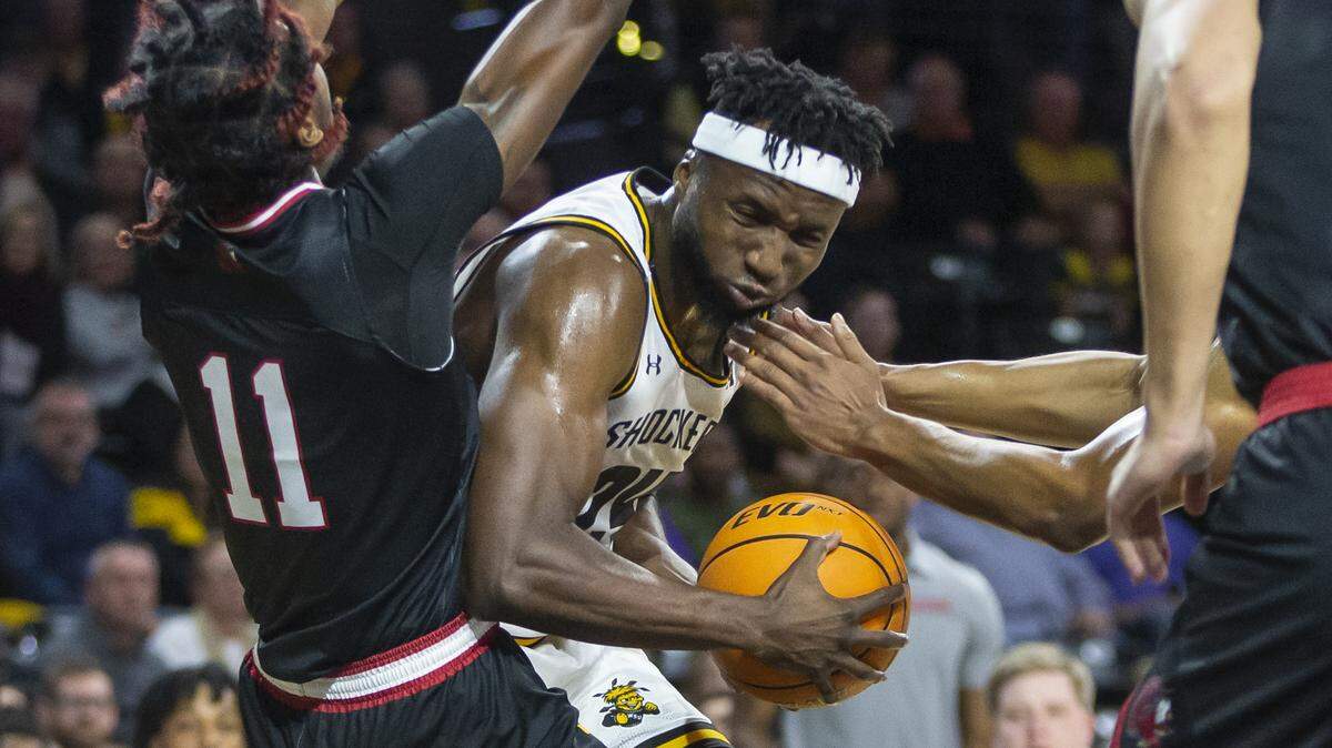 Wichita State’s Morris Udeze commits an offensive fouls against Jacksonville State’s Kayne Henry during the first half on Tuesday at Koch Arena.