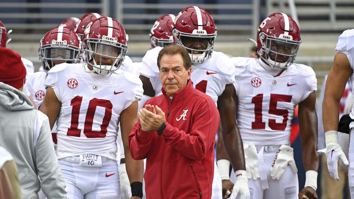 Alabama head coach Nick Saban and players take the field for warmups before an NCAA college football game against Mississippi in Oxford, Miss., Saturday, Nov. 12, 2022. (AP Photo/Thomas Graning)