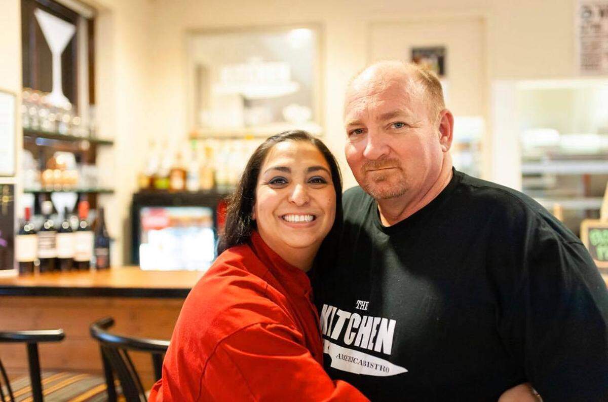 Natasha Gandhi-Rue, left, owner of The Kitchen at 725 E. Douglas, has been invited to appear on an episode of “Today” that features Thanksgiving dishes from every state. She’s pictured here with her husband, Scott Rue.