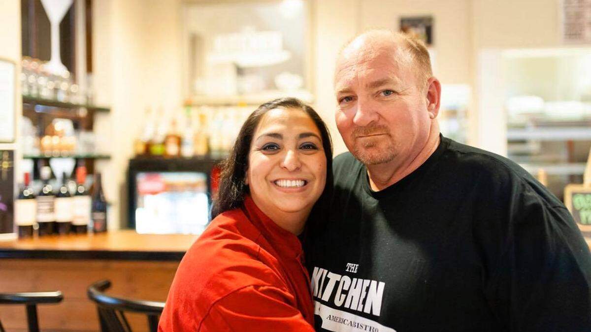 Natasha Gandhi-Rue, left, is changing the focus and the name of her downtown location of The Kitchen. She’s pictured with her husband and co-owner Scott Rue.