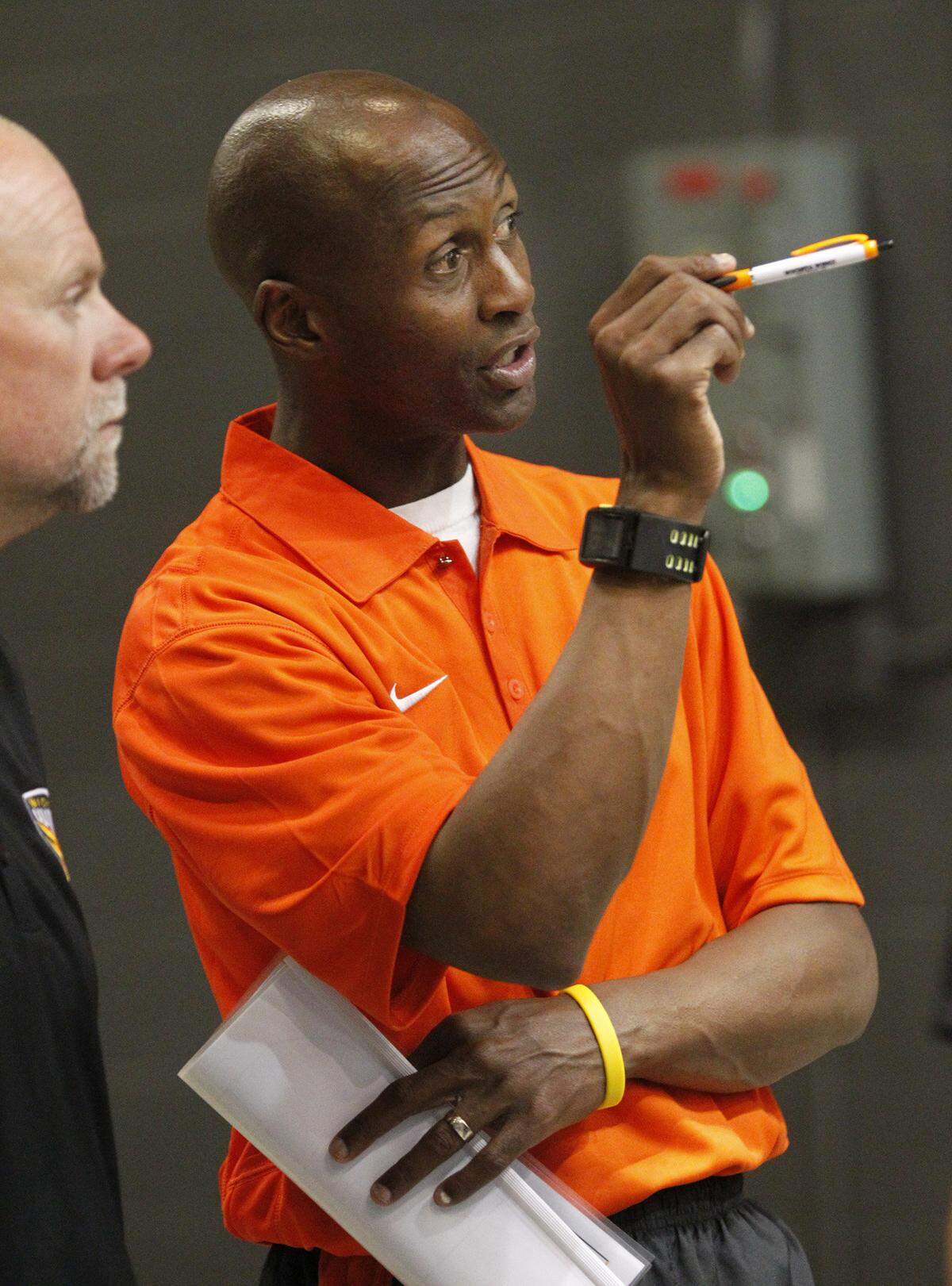 The Wings’ head coach LeBaron Hollimon, right, talks things over with assistant coach Sammy Lane during halftinme as the team makes it’s debut during a scrimmage where they played each other at the Hartman Arena Wednesday. (Oct . 26, 2011)