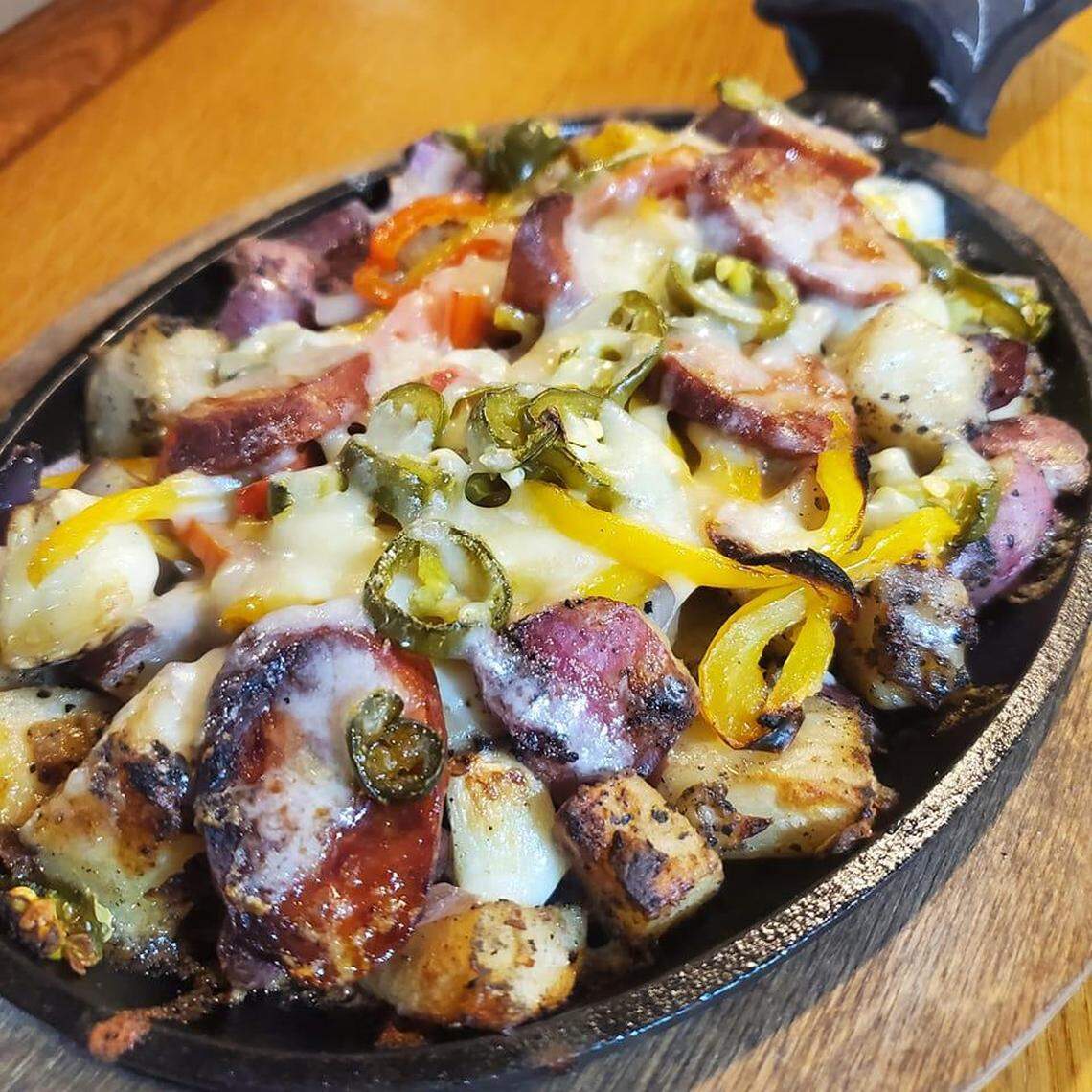 Loaded skillets made by firing various ingredients on top of seasoned potatoes are a specialty at Garden Plain’s Halagains.