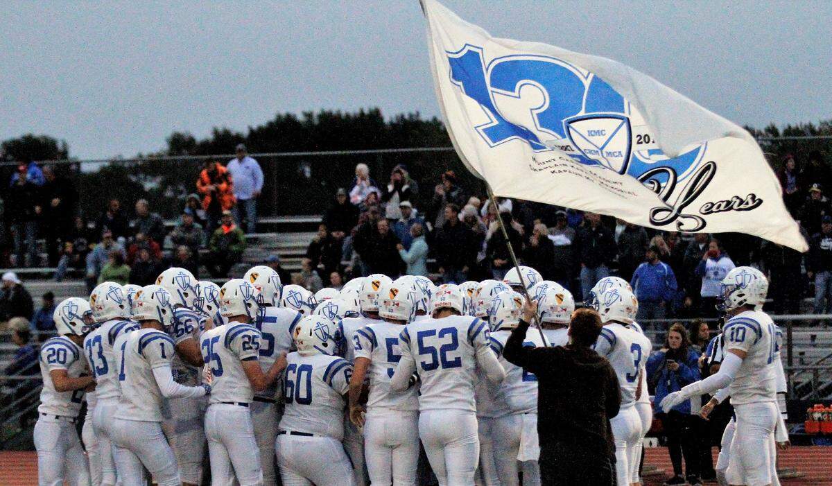The Kapaun Crusaders rally up before their 55-26 loss to Wichita Northwest on Friday. (Sept. 28, 2018)