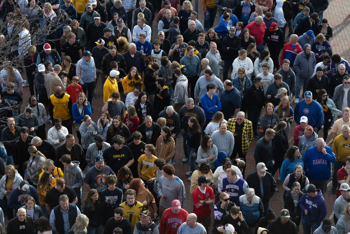Folks line up to enter Intrust Bank Arena to watch the second set of two games in the first round of the 2025 NCAA Division I Men’s Basketball Championship