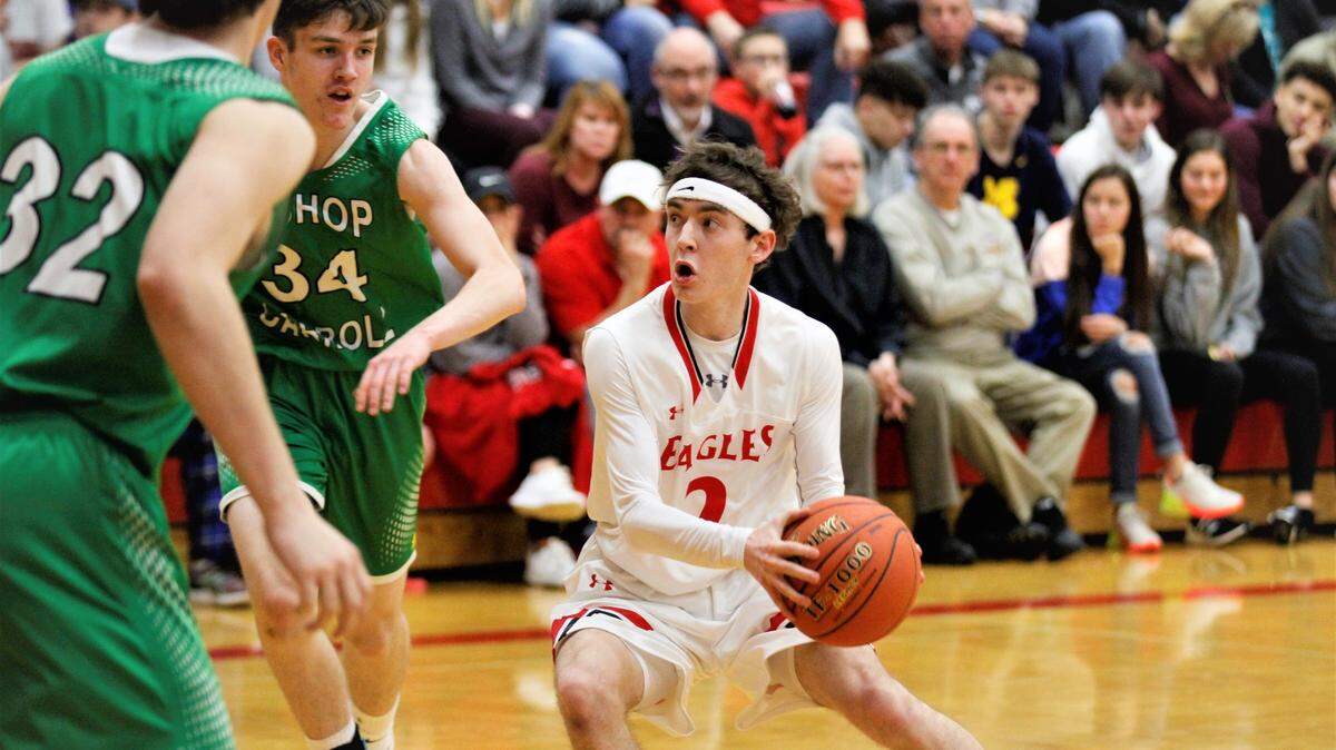 Maize senior guard Chase Schreiner hesitates in the paint during the Eagles’ 56-52 overtime win on Friday as part of the AVCTL/GWAL Challenge. (Jan. 11, 2019)