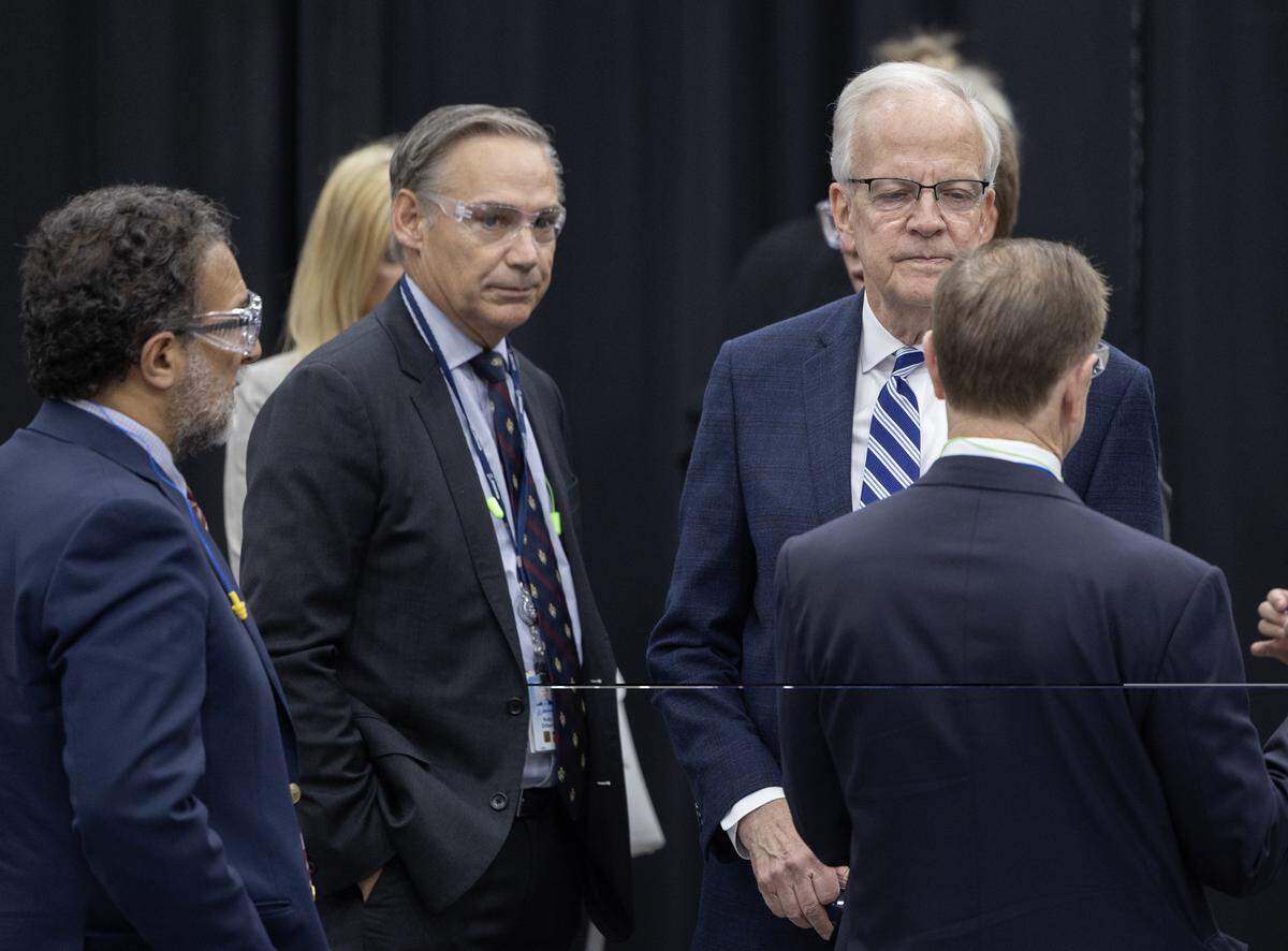 Boeing CEO Kelly Ortberg, left, and Sen. Jerry Moran visit with other dignitaries at an event at the Boeing Wichita campus on Monday. Ortberg announced that company would invest a billion dollars over three years in Wichita.