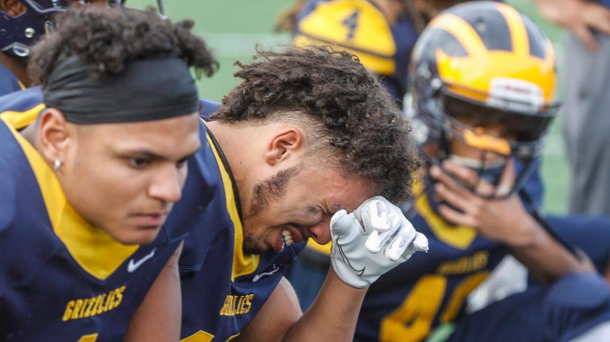 Wichita Northwest’s Kaleb Coleman cries after his team lost the 5A Championship game to Mill Valley on Saturday.