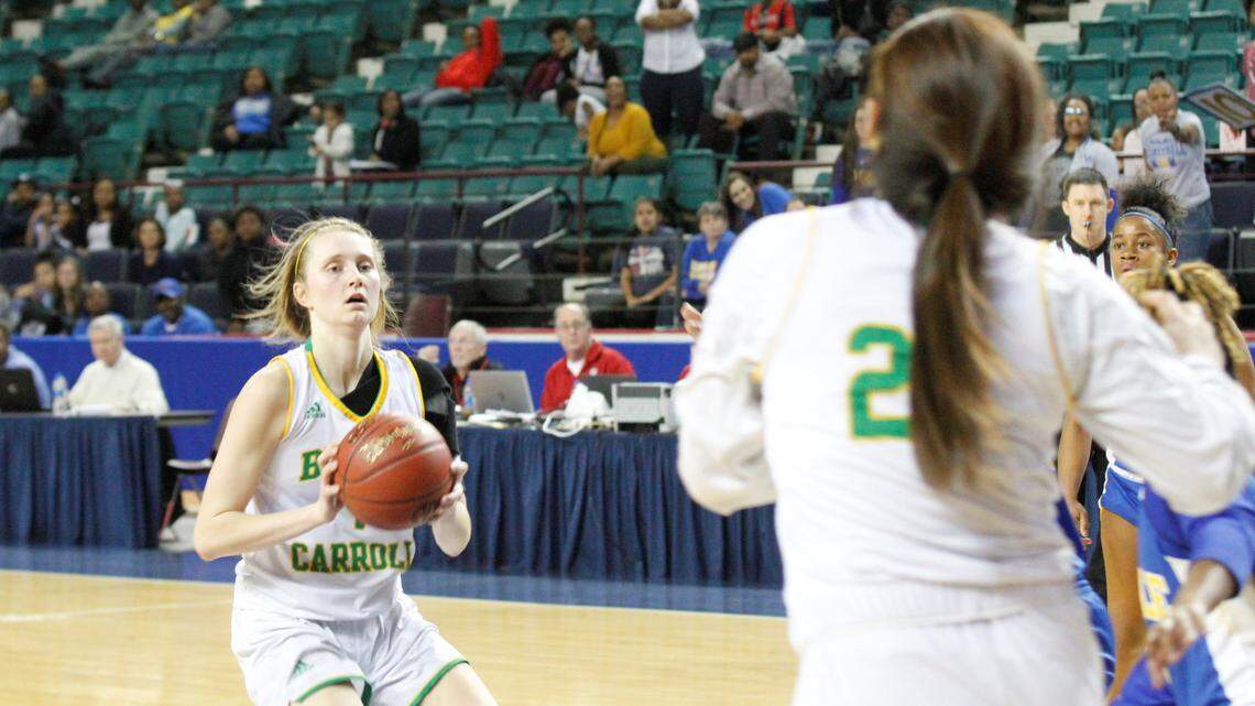 Carroll senior Ashton McCorry delivers a pass during the Eagles' 77-56 victory against Schlagle in the first round of the Class 5A girls basketball tournament at the Kansas Expocentre in Topeka.
