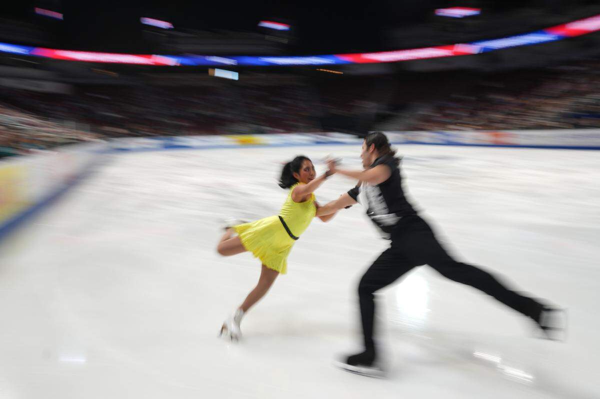 Michela Melillo and Karl Schapfel perform during the ice dance rhythm dance competition at the U.S. figure skating championships at Intrust Bank Arena.