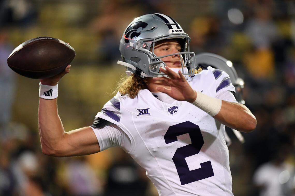 Kansas State Wildcats quarterback Avery Johnson (2) warms up before the game against the Colorado Buffaloes at Folsom Field.