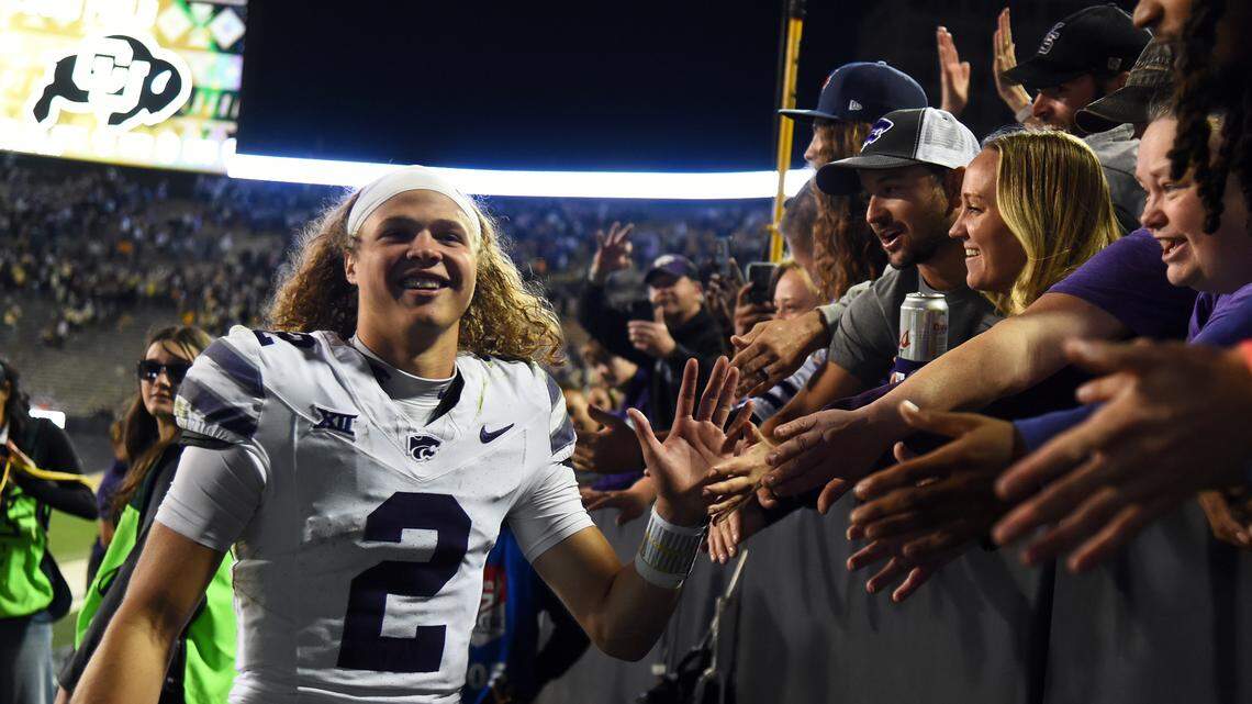Kansas State Wildcats quarterback Avery Johnson (2) celebrates with fans after a win against the Colorado Buffaloes at Folsom Field.