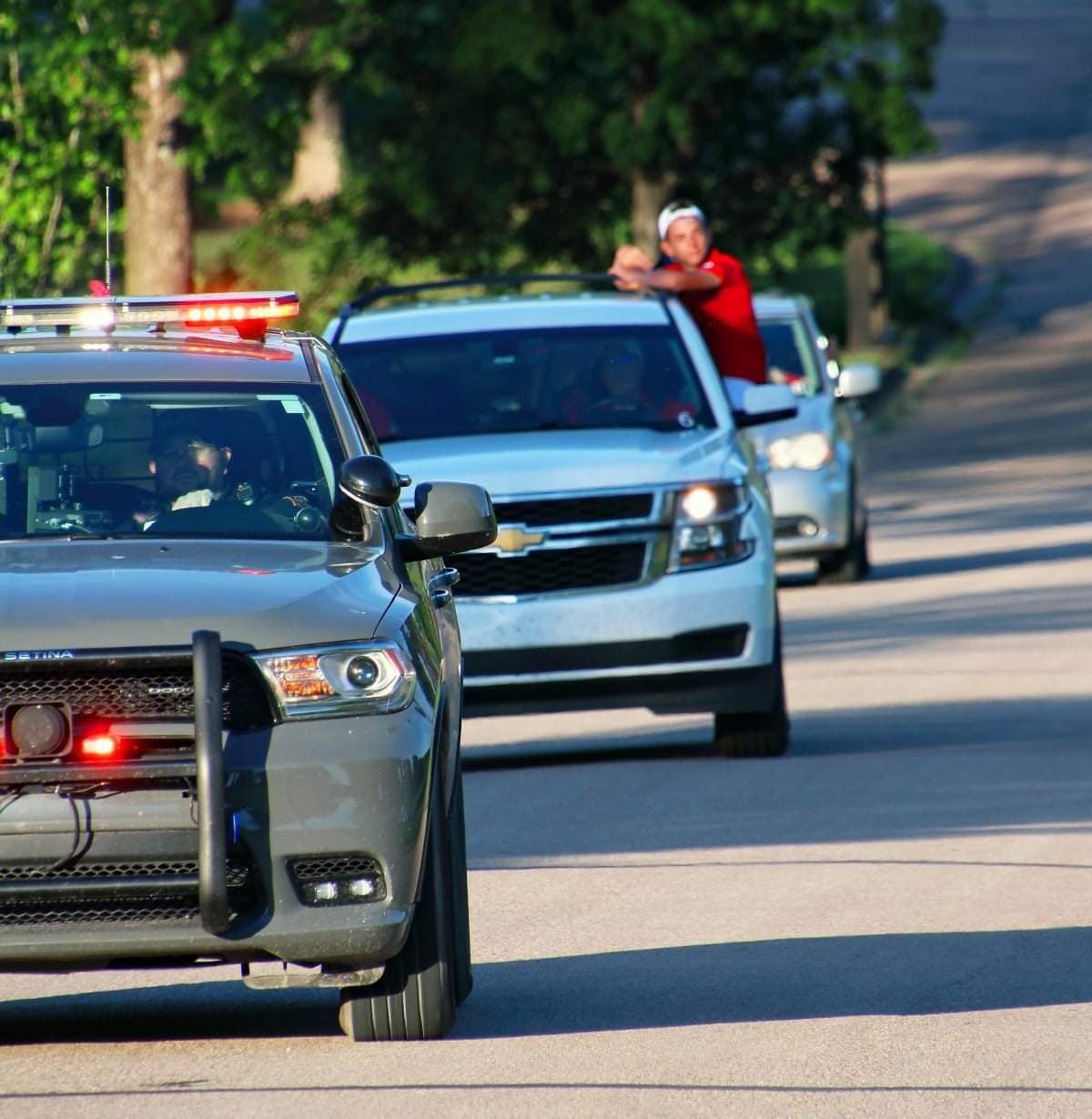 The Wellington boys golf team received a police escort back to the Wellington Golf Course, where members of the community awaited to celebrate with them following their Class 4A championship on Tuesday.