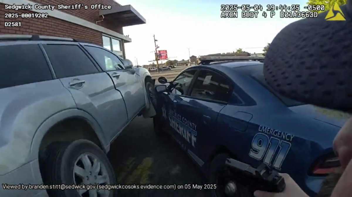 The Sedgwick County Sheriff’s Office provided this bodycam footage photo of the incident at a McDonald’s drive-thru, where a stolen vehicle rammed a patrol vehicle.