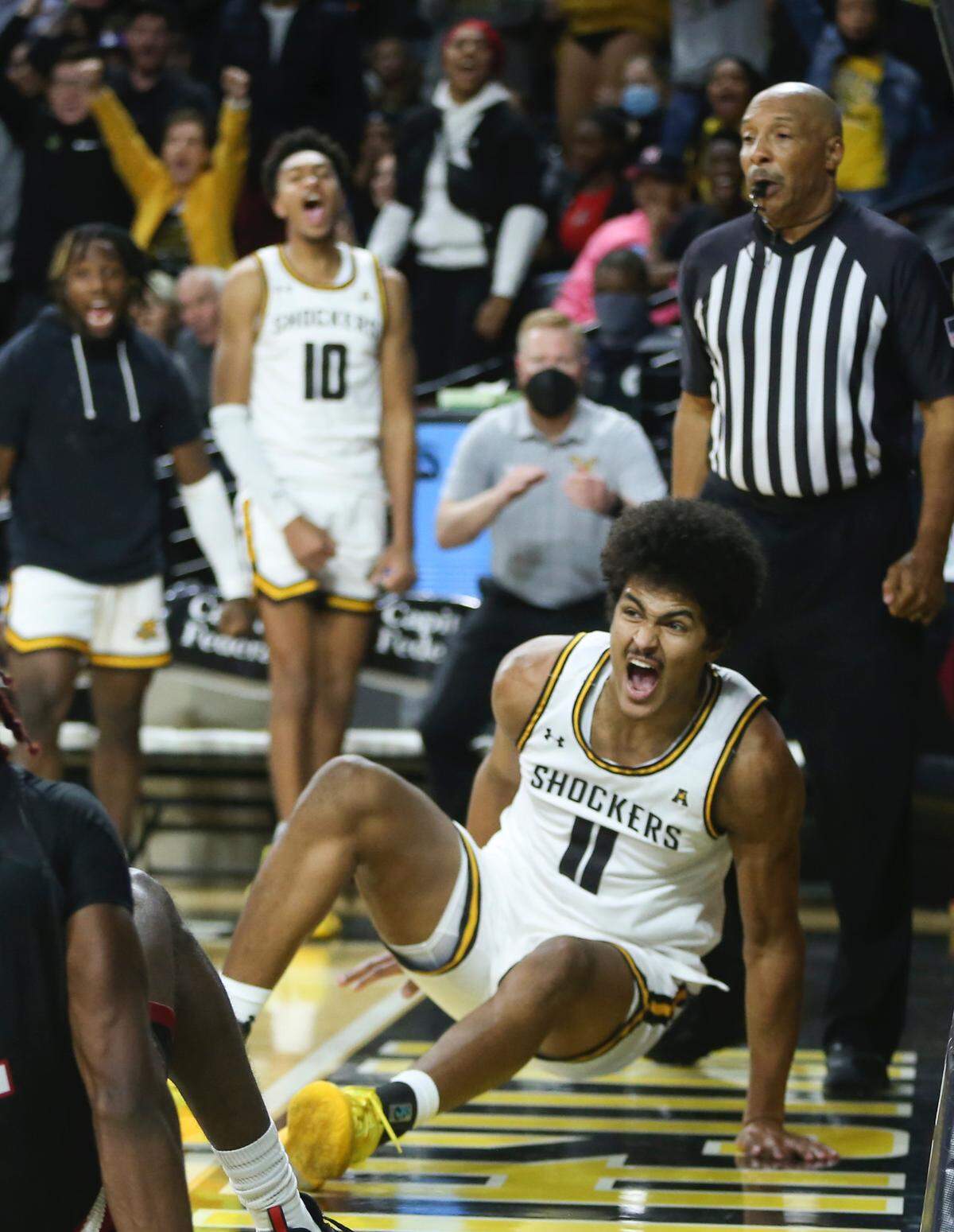 Wichita State’s Kenny Pohto reacts as he falls to the ground after making a dunk against Jacksonville State in the second half on Tuesday.