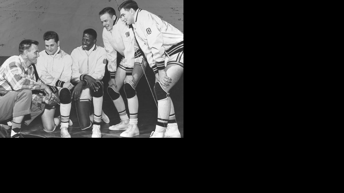 WU coach Ralph Miller poses prior to the 1952-53 opener with four home-grown Shockers: From left, Gary Thompson, Cleo Littleton, Paul Scheer and Sherrill Compton.

