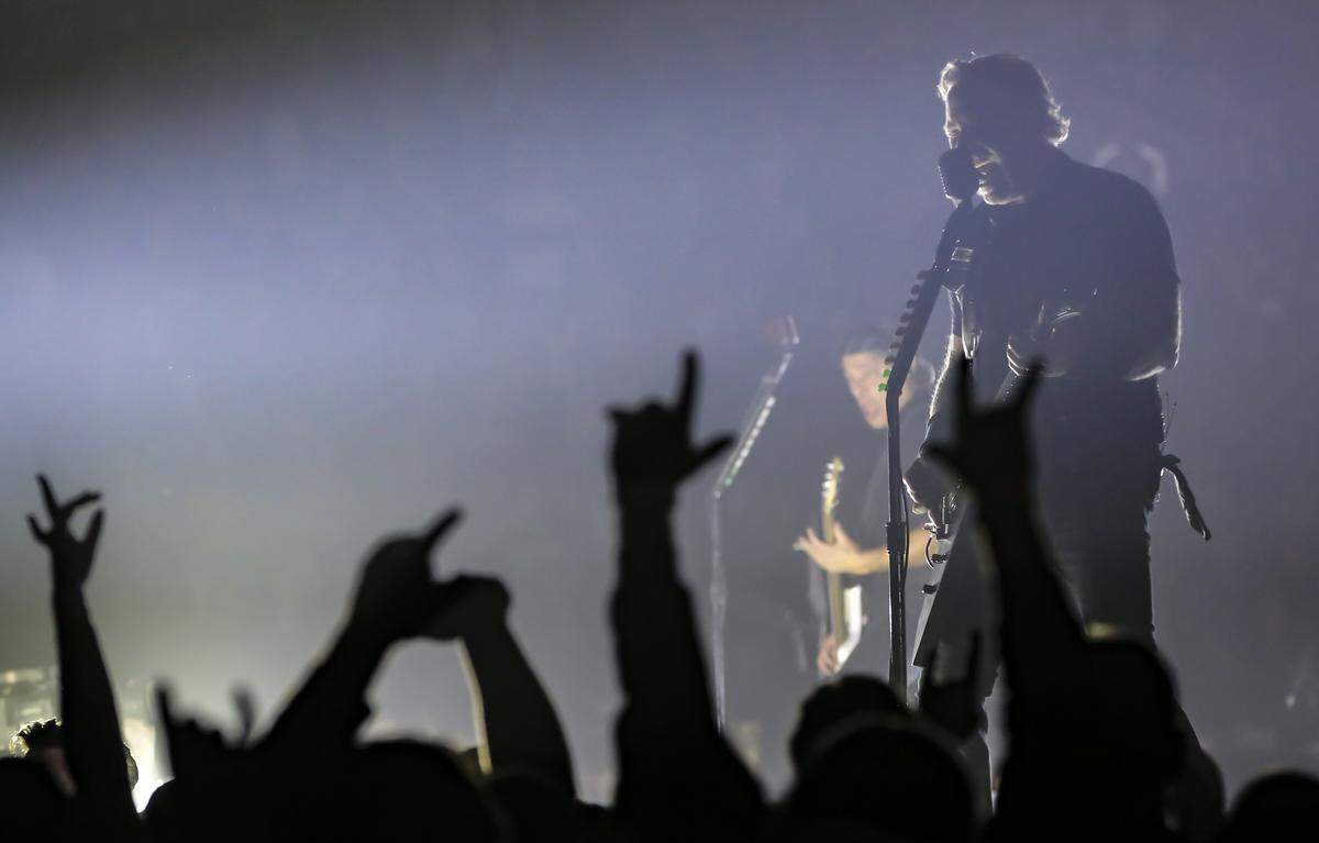 Singer James Hetfield of the band Metallica plays for a record crowd of 15,690 at Intrust Bank Arena on Monday night.