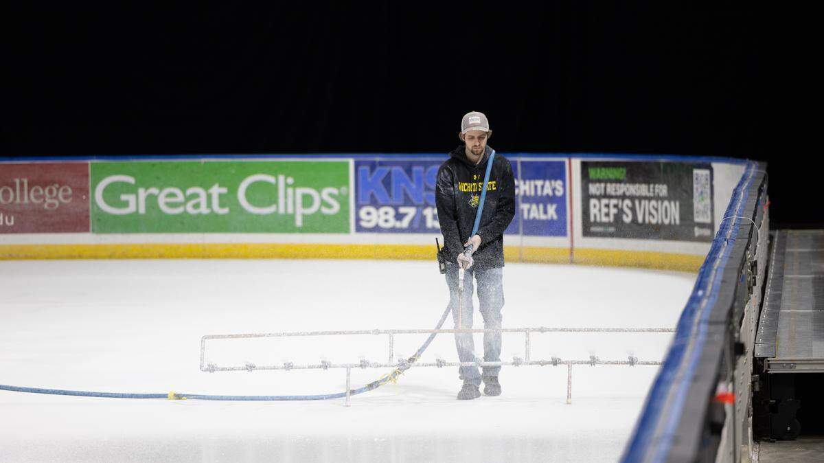 White paint is applied to the ice at Intrust Bank Arena on Thursday in preparation for the U.S. Figure Skating Championships that are coming to Wichita this week.