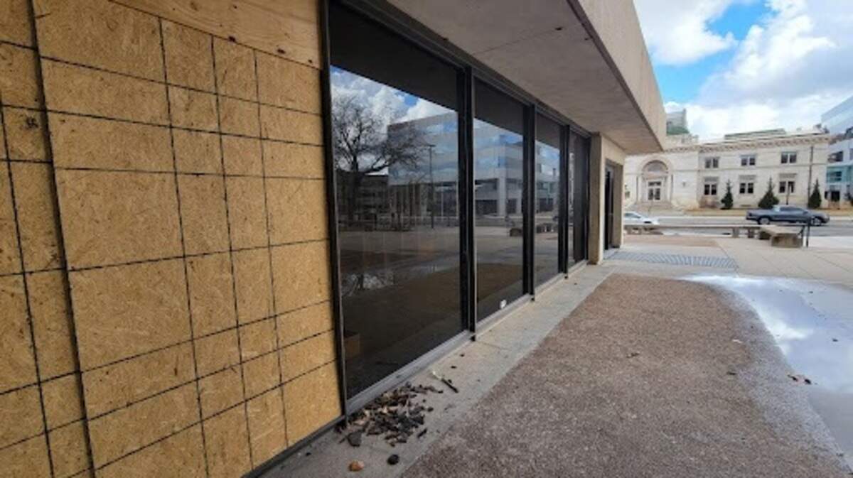 A window boarded up at the former downtown Wichita library is one of a several that were smashed over the weekend, Wichita police say