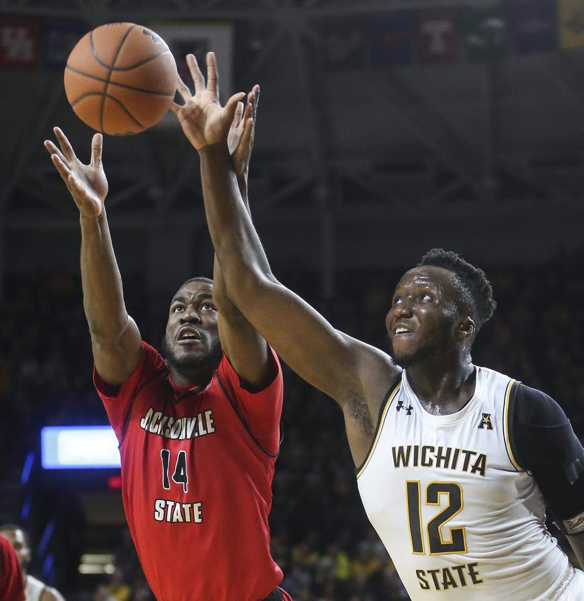 Wichita State forward Morris Udeze battles for a rebound against Jacksonville State forward Jason Burnell during the second half of their game at Koch Arena on Wednesday.