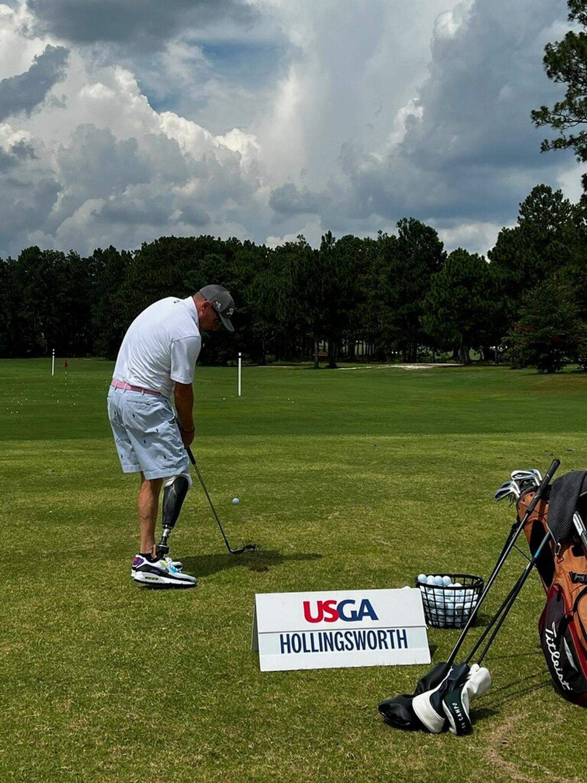 Greg Hollingsworth hits a practice shot at the US Adapative Open at Pinehurst Country Club.
