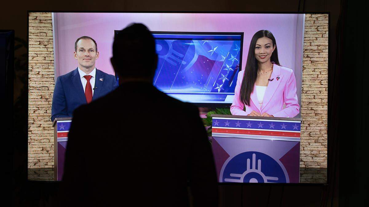 Brandon Whipple, left, and Lily Wu take part in a debate at the KAKE news studio on Tuesday night. The election that will decide Wichita’s next mayor is Nov. 7.