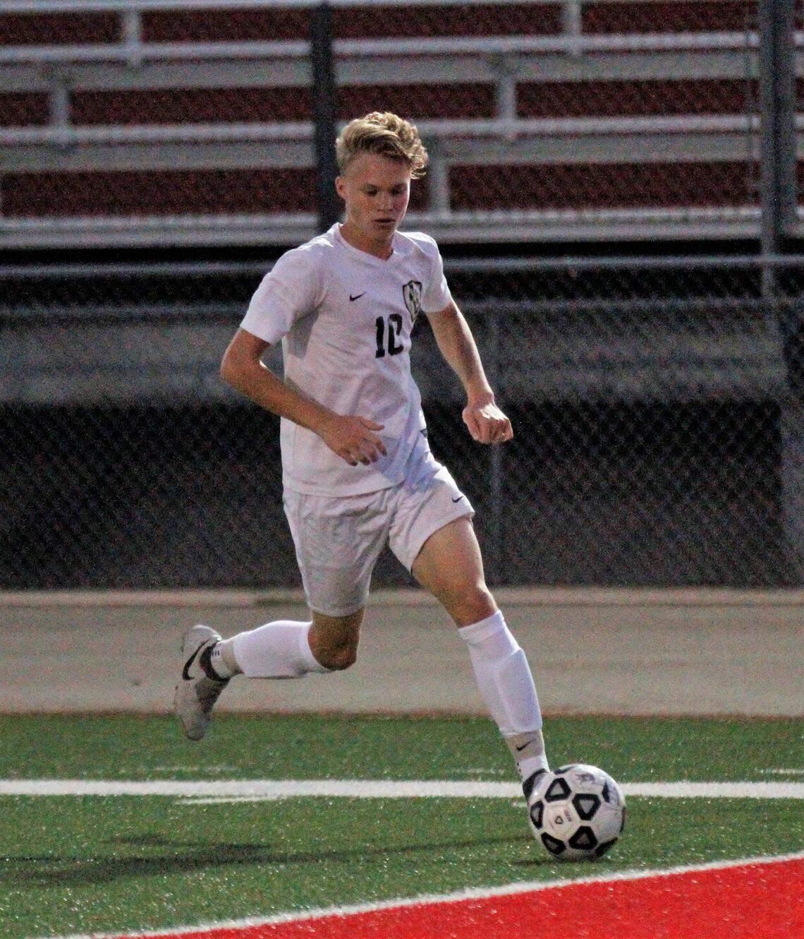 Andover Central’s Leyton Harper looks to send in a cross during the Jaguars’ 2-0 win at Rose Hill on Monday. (Aug. 28, 2018)