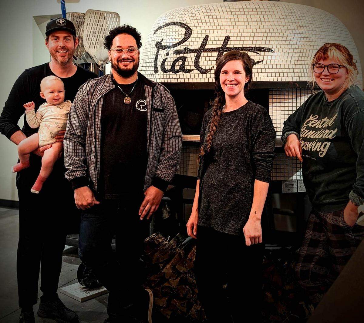 Piatto’s staff now includes owner Robert McMullin, left, holding baby daughter Olive, plus Julian Langston (second from left); Kaylee Frazell, Olive’s mom (second from right), and Emmy Graves (right.)