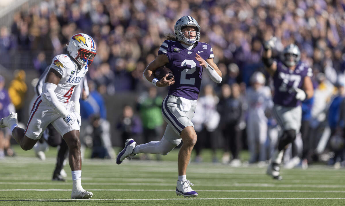 Kansas State quarterback Avery Johnson runs for a long gain against Kansas during the first half in Manhattan on Saturday, Oct. 17, 2026.