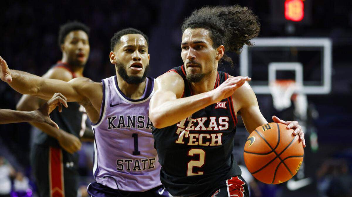 K-State’s Markquis Nowell (left) guarded Texas Tech guard Pop Isaacs during the first half on Saturday, Jan. 21, 2023, in Manhattan, Kan. Nowell scored a game-high 23 points.