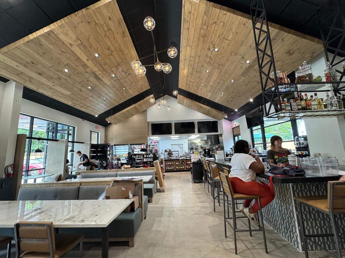 People who dine inside at Point Nine can either take a seat and wait for a server or order food at the counter. The indoor area also has a full bar.