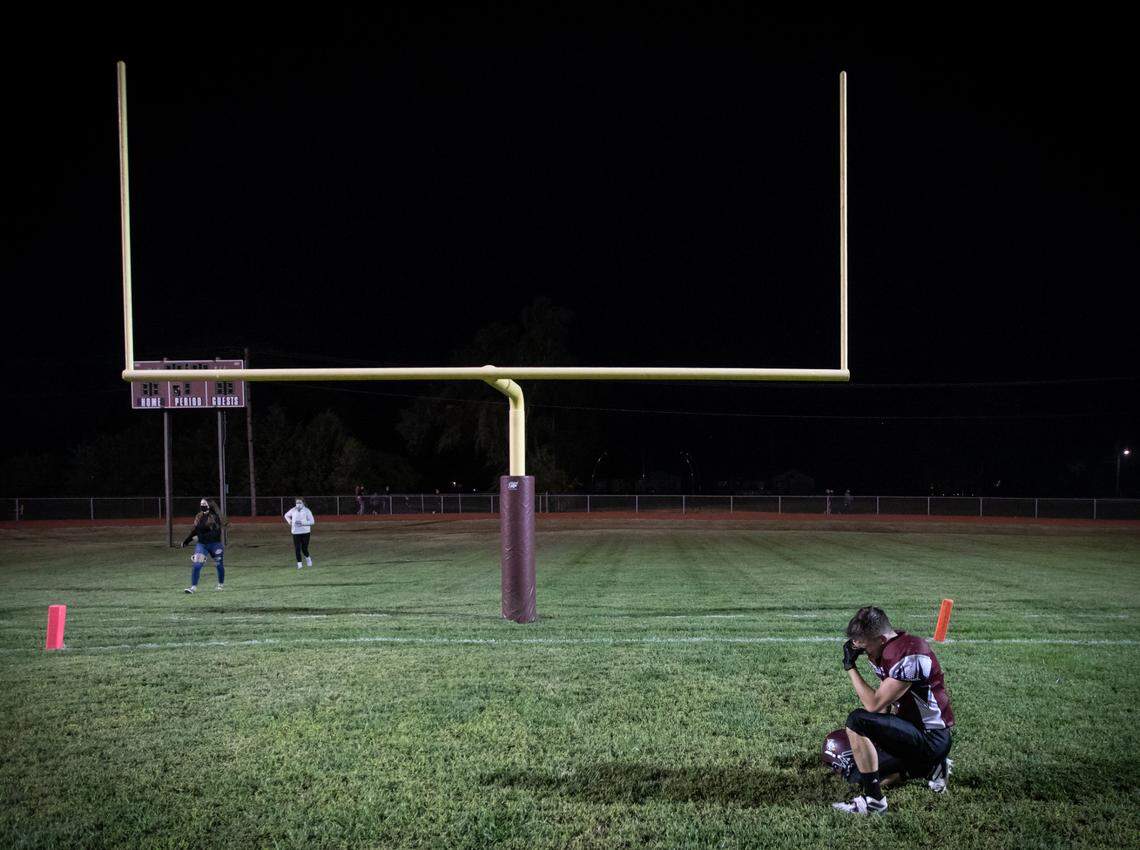 A player for the Burrton Chargers is overcomes with emotion after the six-man team won their first game in three years on Friday. Burrton defeated Fowler 71-34
