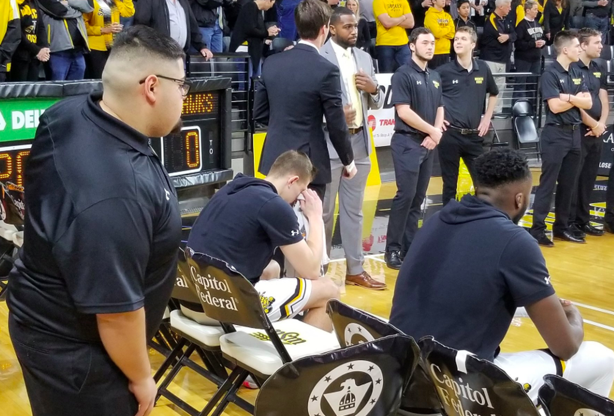 Wichita State sophomore Erik Stevenson becomes emotional on the bench following a pre-game moment of silence in honor of his late grandfather, Ron Wilson.