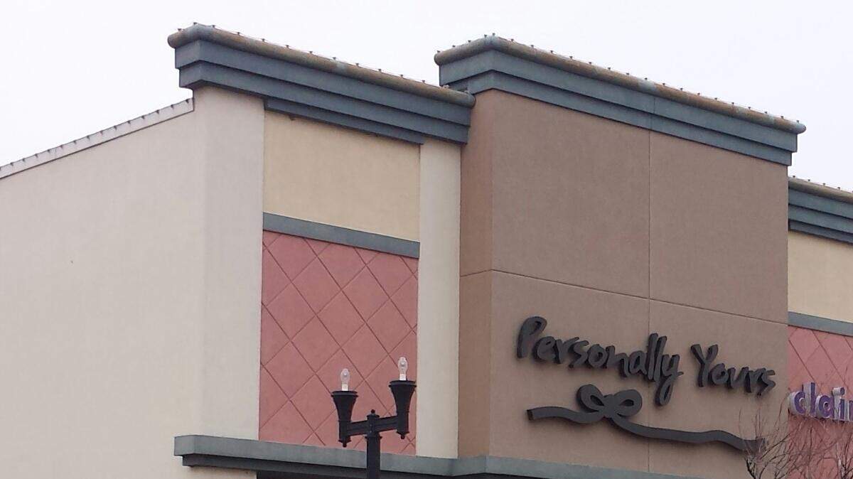 The store, which sells personalized items such as frames and jewelry, is at NewMarket Square at 21st and Maize Road.