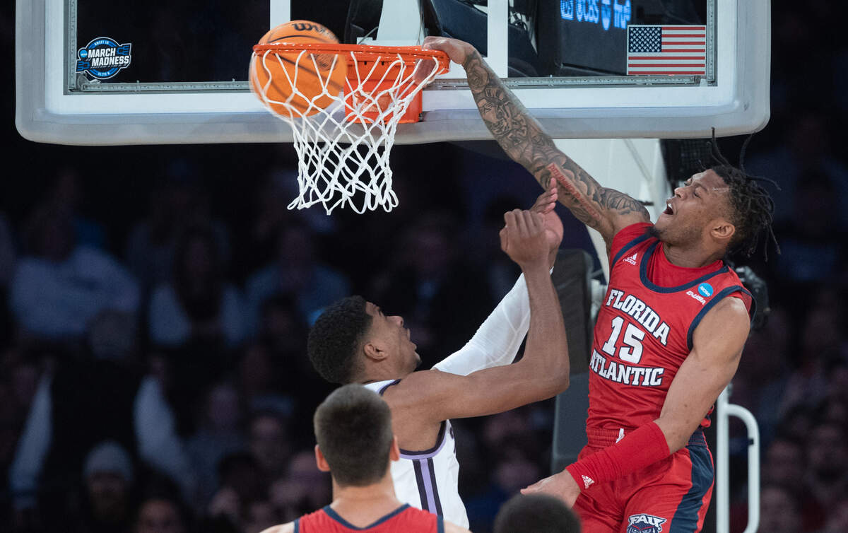 Florida Atlantic’s Alijah Martin dunks the ball over Kansas State’s David N’Guessan during the first half of their east region final game at Madison Square Garden on Saturday night.