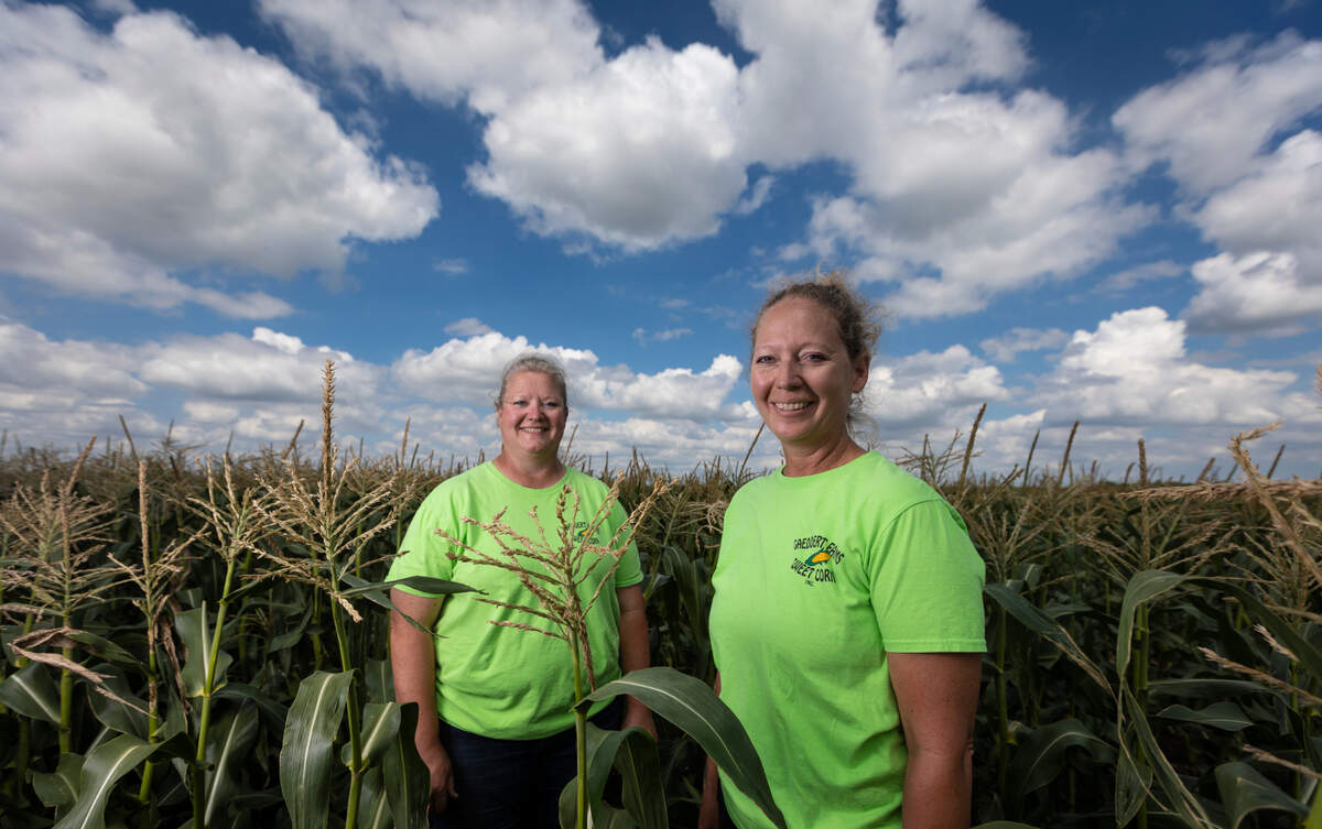Julie Ball, left, and her sister Tonya Martisko run Gaeddert Farms Sweet Corn near Buhler. The familiar green and yellow canopies are common sights around Wichita and other Kansas communities in the summer.