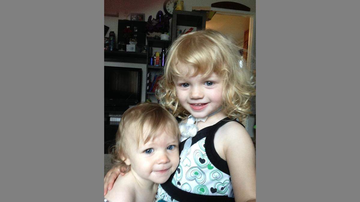 Isabella Bisher, right, is pictured with her sister Elizabeth. The three-year-old from Florissant is one of hundreds of Missouri children with special needs who qualify for state-covered home nursing.