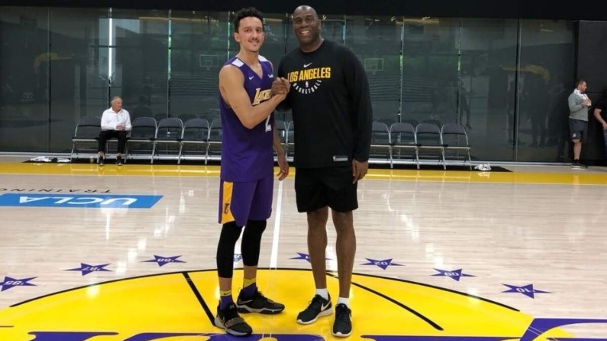 Landry Shamet poses with Magic Johnson, a former Lakers great and current president of basketball operations, following a workout with the Los Angeles Lakers on Thursday.