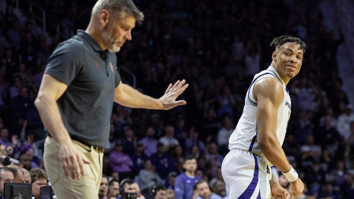 Kansas State’s Keynote Johnson looks back at Oklahoma coach Porter Moser after hitting a shot in front of him during the first half on Wednesday night in Manhattan.