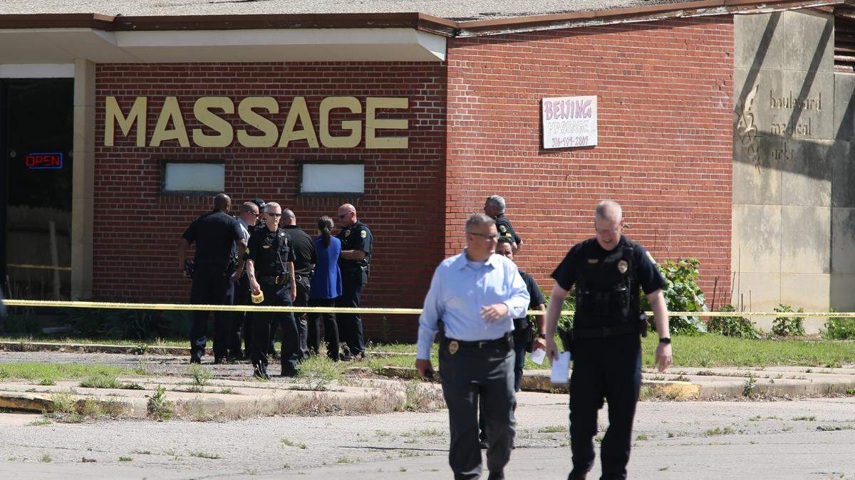 Wichita police officers and homicide detectives investigate a shooting at a massage parlor in southeast Wichita on May 22. One man died and another was taken to a hospital.
