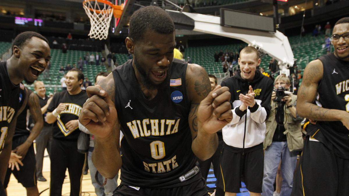 Wichita State  forward Chadrack Lufile (0) dances after the Shockers beat No. 1 Gonzaga in the second round of the 2013 NCAA Tournament.