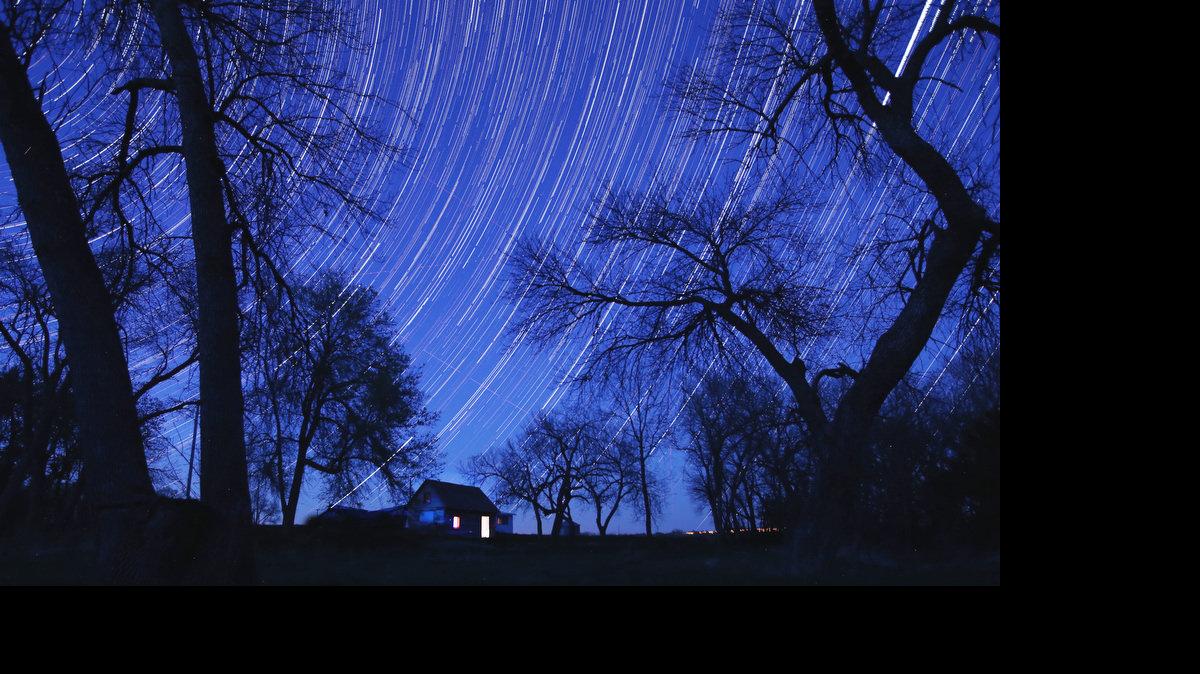 Star trails paint the night sky above the Home on the Range Cabin. Home on the Range cabin built was 1872 by Brewster Higley, author to the words of Home on the Range song. ---The photo is a composite photo of more than 500 individual photos to capture the night sky. (May 2, 2014)